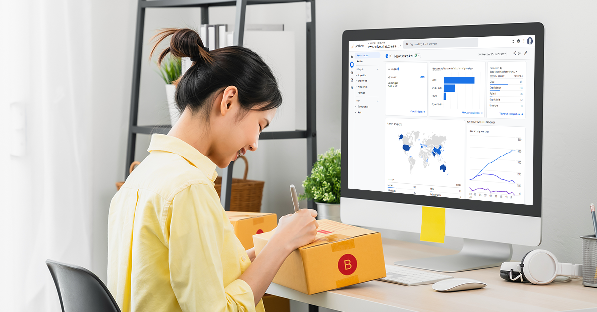 ecommerce business owner looking at ga4 events and writing on a package